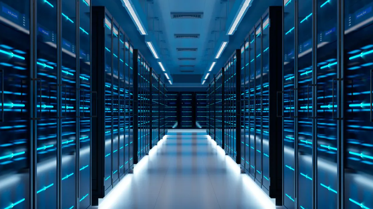A modern data center corridor with rows of illuminated server racks featuring blue LED lights