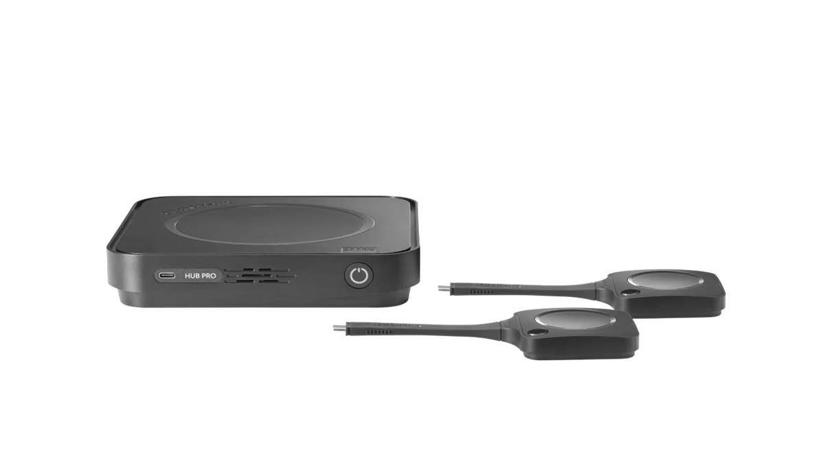 ClickShare Hub Pro with two next generation ClickShare Buttons designed for wireless 4K content sharing