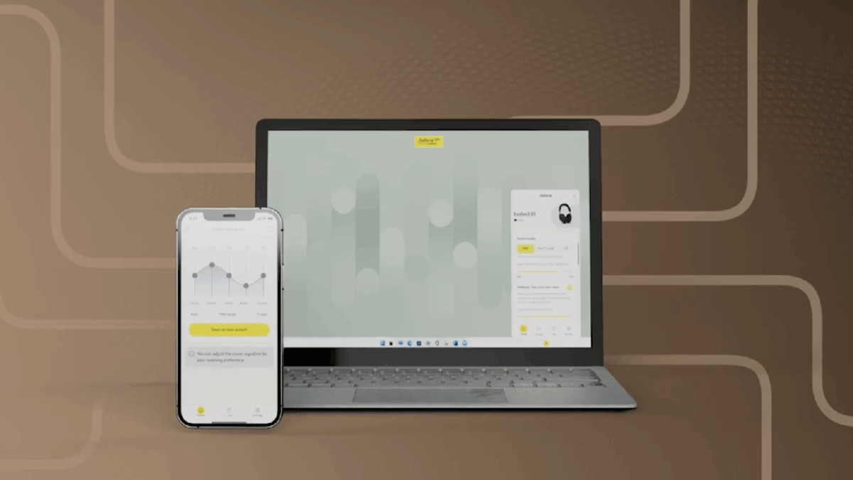 A mobile phone in front of a laptop, featuring the Jabra Plus Mobile and Desktop App for Evolve3 device management
