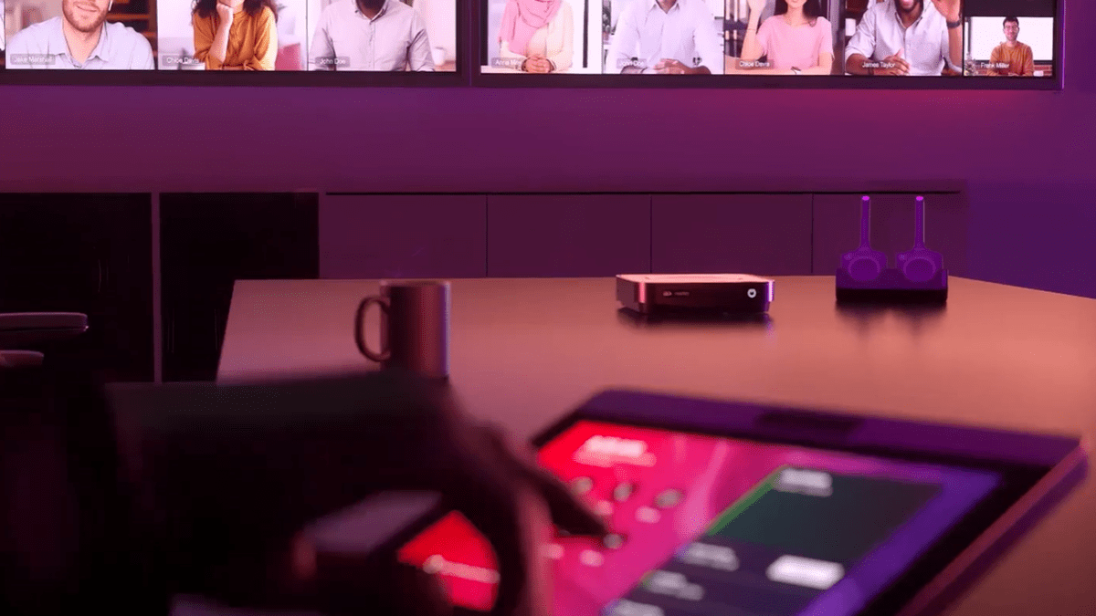 People having a hybrid meeting featuring Barco’s ClickShare Hub