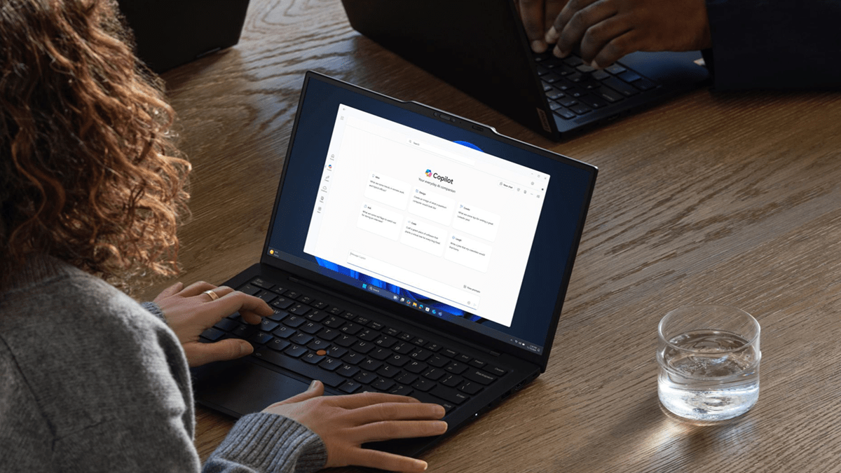 A woman using her laptop to access Microsoft Copilot