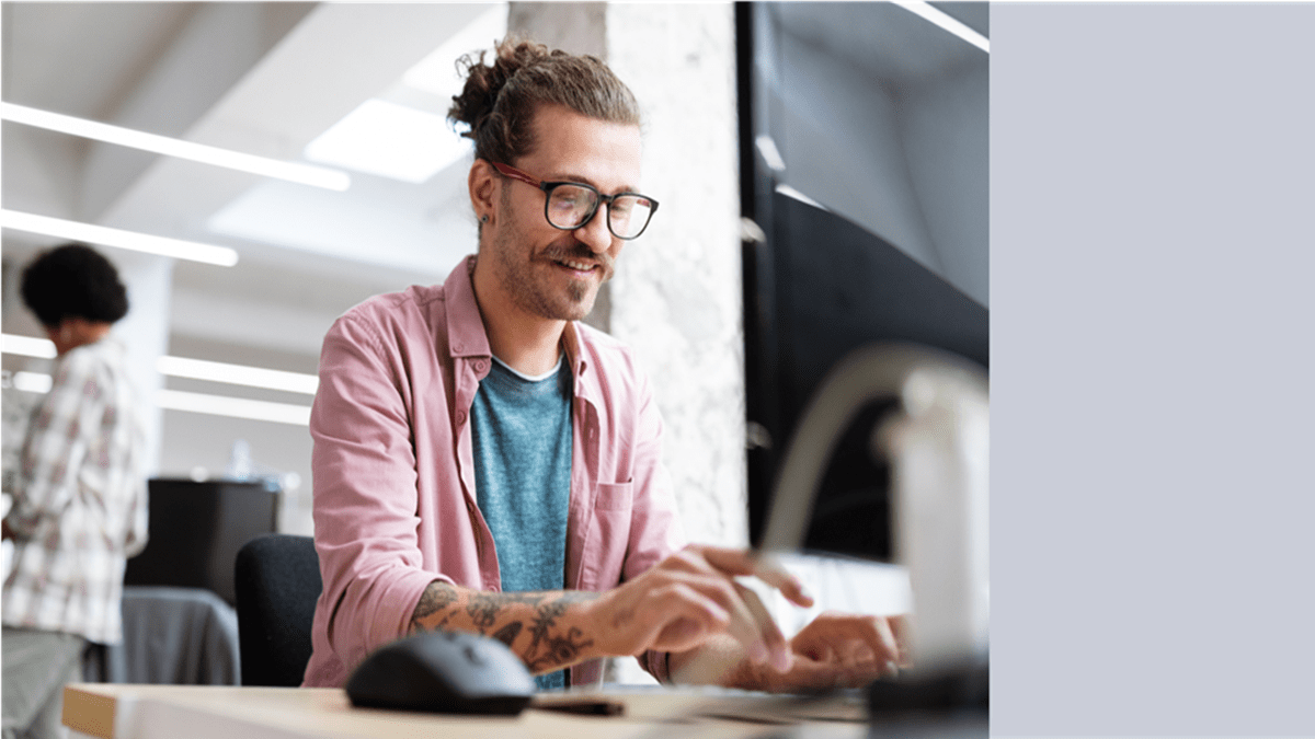 A man typing on his keyword at work to process email data with the help of Twilio’s Data Residency for Email