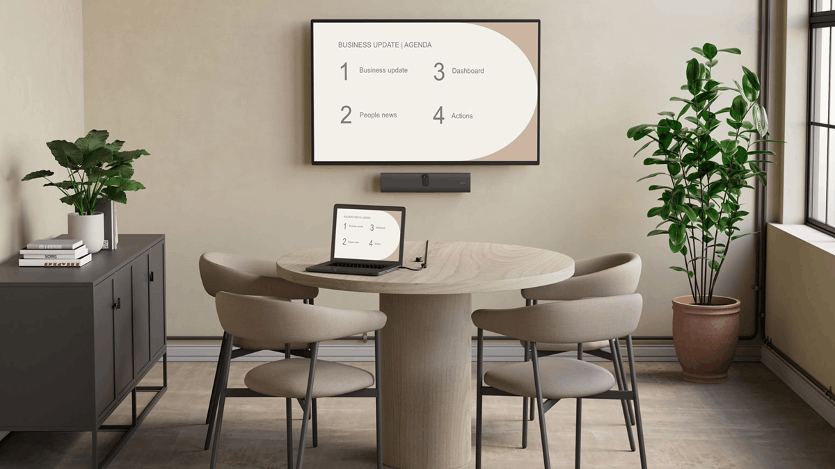 Jabra Reach devices shown beside a video meeting room setup with a laptop, display, and room camera