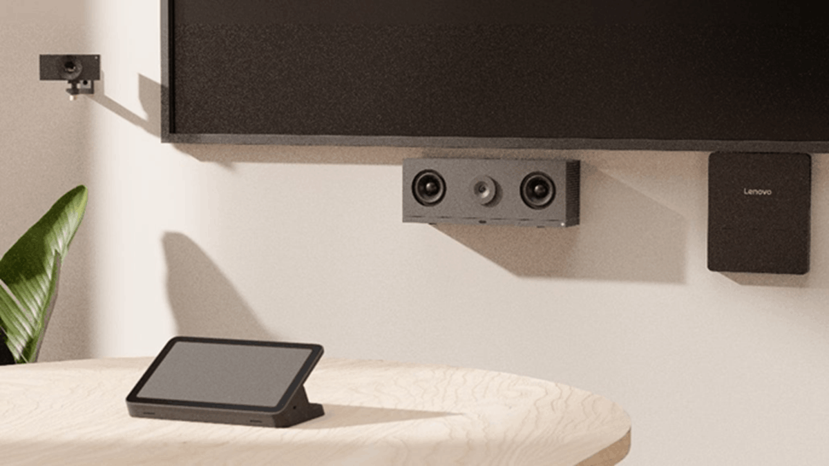 Lenovo ThinkSmart meeting room setup with wall-mounted display, Huddly camera, and table controller