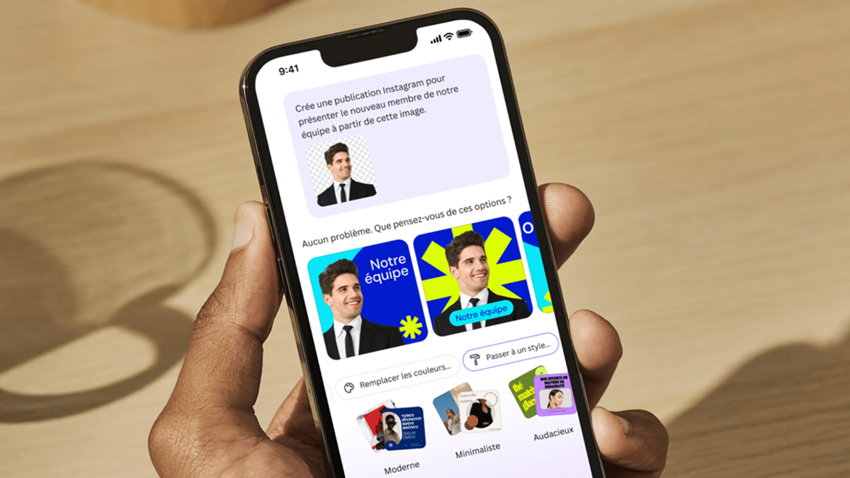 A hand holding a smartphone using Canva AI assistant to generate design options
