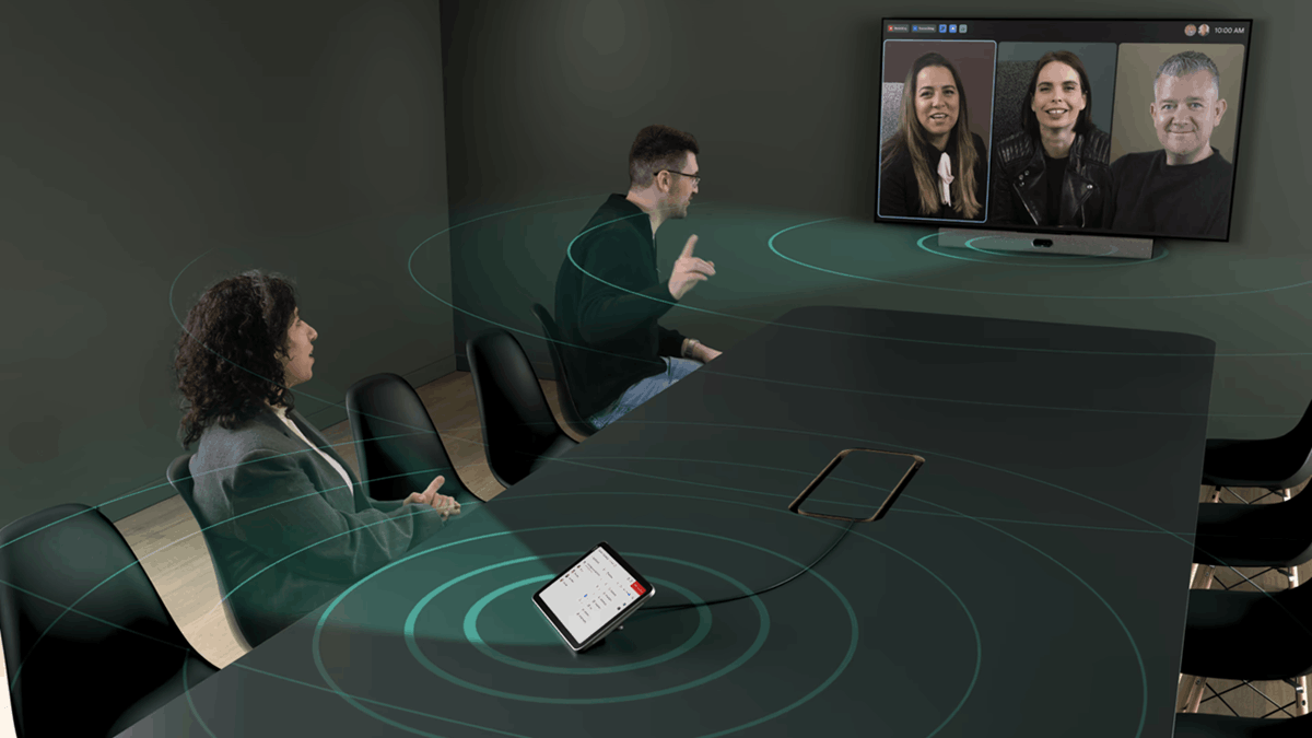 Five people in a hybrid meeting using Neat Pad Pro