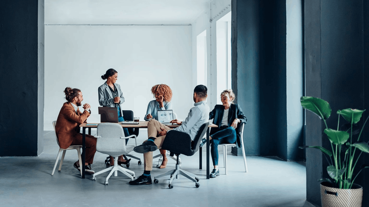 Business professionals collaborating around a meeting table in a modern office