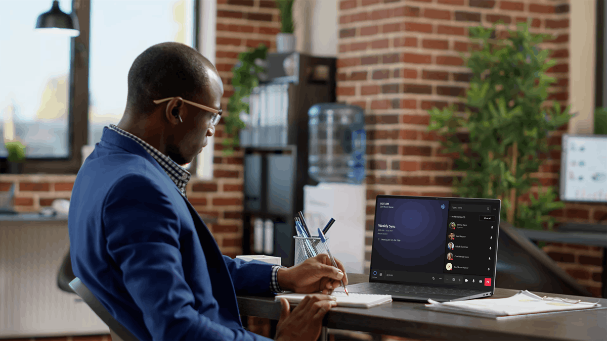 A professional working on a laptop connected to a virtual meeting, illustrating secure virtual workspace access supported by Dell ThinOS for VDI environments