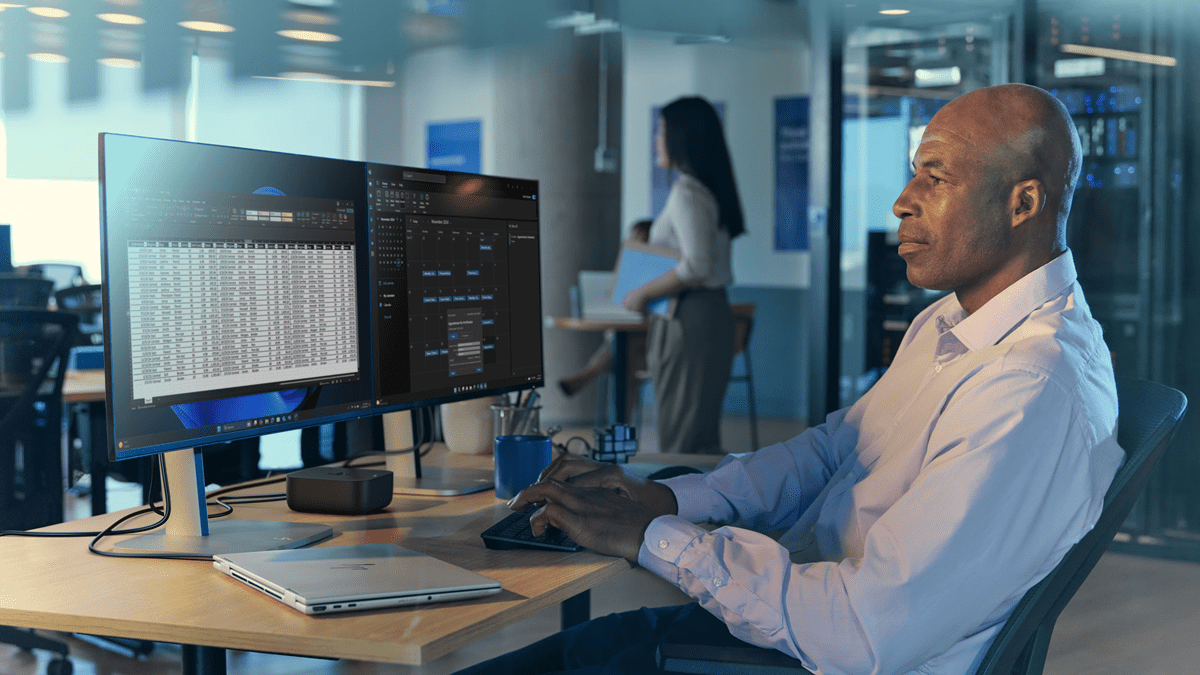 A man using HP devices and peripherals in an office