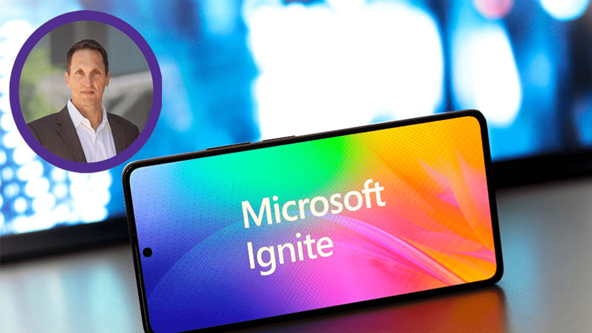 An image of Microsoft Ignite’s logo over a multi-colored background displayed on a smartphone with Craig Durr’s photo on the upper left
