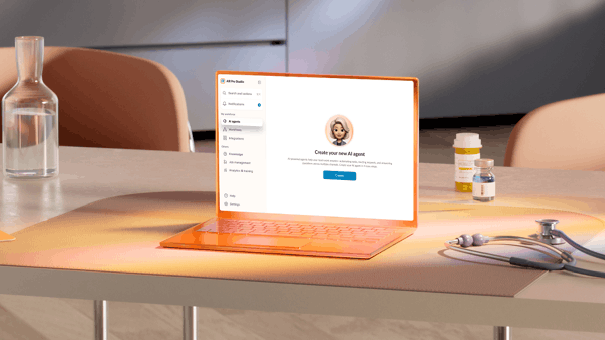 A laptop displaying an AI agent creation interface on a desk with healthcare items, representing RingCentral's AI-powered customer engagement and workflow automation capabilities