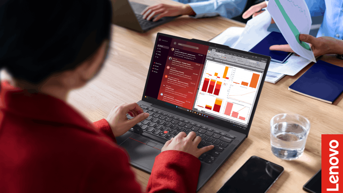 Professional using a Lenovo ThinkPad laptop during a business meeting with productivity applications open
