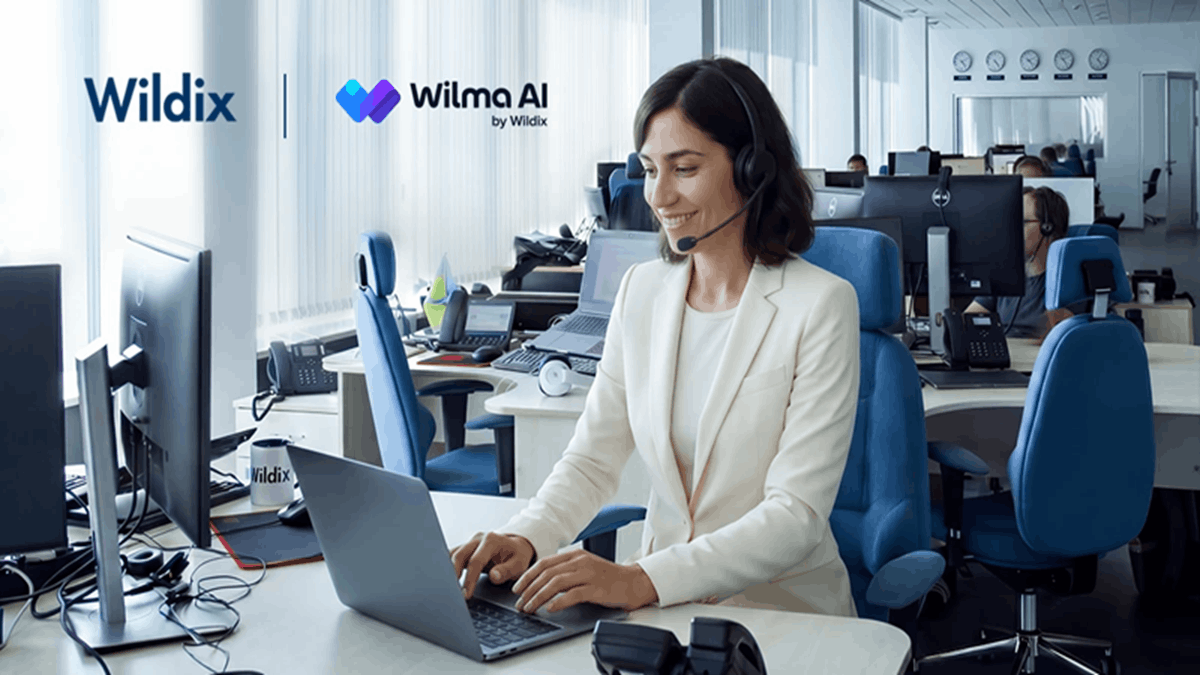 Support agent using a headset and laptop in a modern office, with Wildix and Wilma AI branding representing AI-powered Level 1 technical support automation